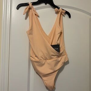 Pretty little thing NEW WITH TAGS peach bodysuit plunge with tie straps small